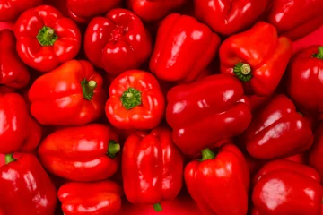 Fotobehang Fresh red bell pepper background. © Nikolay