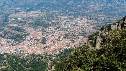 Aerial view of the city of Oliena out of the Supramonte mountain, Barbagia region, Sardinia, Italy.