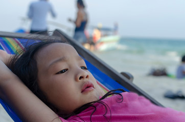 Closeup little girl relaxed on the beach