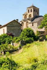 Fototapeta na wymiar The beautiful Romanesque church of the small village of Liaucous in Aveyron, France