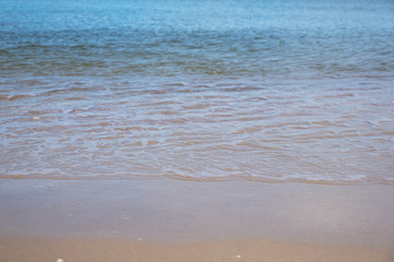 Landscape image of tropical white beach with blue sea and sky background