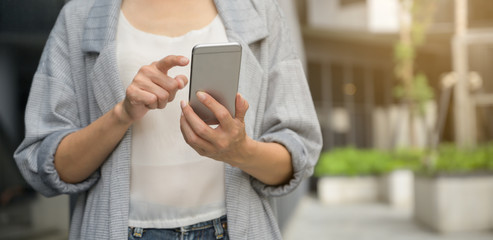 Close up. Young asian woman using smart phone. searching or social networks concept.