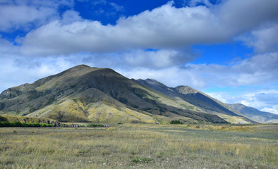 Landscape in New Zealand - clouds over of the mountains. Molesworth station, South Island.