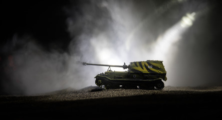 War Concept. Military silhouettes fighting scene on war fog sky background, Silhouette of armored vehicle below Cloudy Skyline At night. Attack scene. Tanks battle.