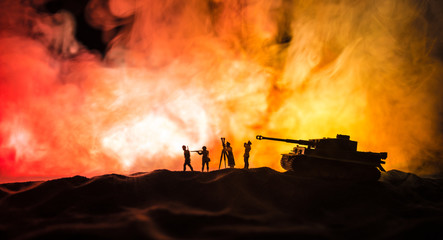 War Concept. Military silhouettes fighting scene on war fog sky background, World War German Tanks...