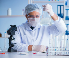 Female scientist researcher conducting an experiment in a labora