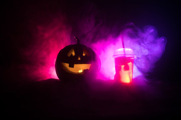 Halloween pumpkin orange cocktails. Festive drink. Halloween party. Funny Pumpkin with a cocktail. Selective focus