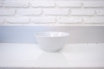 Naklejka na ściany i meble empty white cup on wooden table