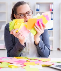 Businesswoman with conflicting priorities in office