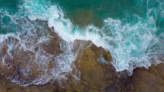 Top view of the desert stony coast on the Atlantic Ocean. Coast of the island of Tenerife. Aerial drone footage of sea waves reaching shore