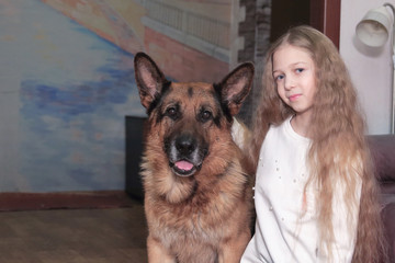 portrait of a teenage girl and her friendly big dog