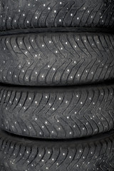 Obraz premium Winter studded rubber. Four studded wheels.
