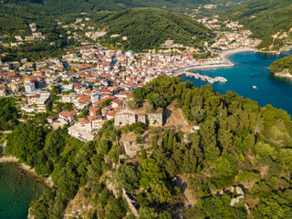 Aerial drone view to historical castle of Parga. Located on the top of a hill overlooking the town. Greece
