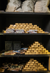 Bank vault with gold and cash