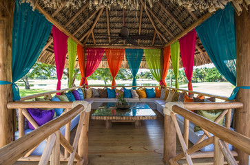 lounge gazebo with curtains and pillows at tropical place