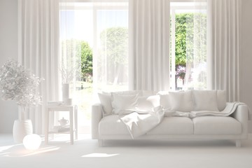 Mock up of stylish room in white color with sofa and green landscape in window. Scandinavian interior design. 3D illustration