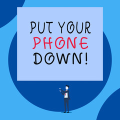 Handwriting text Put Your Phone Down. Conceptual photo end telephone connection saying goodbye caller Isolated view young man standing pointing upwards two hands big rectangle