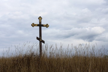 Christian cross on blue sky background