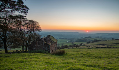 The Roaches End Farm and a misty autumn sunset