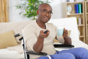 disabled man watching sports on tv