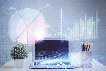 Double exposure of chart and financial info and work space with computer background. Concept of...