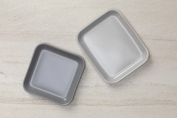 Group of empty blank ceramic square plates on white stone blackground, Top view of traditional handcrafted kitchenware concept