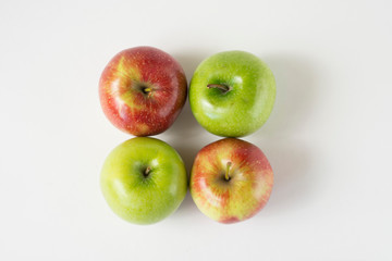 red and green apples with slices and leaves isolated on white background top view. Set or collection. Flat lay pattern