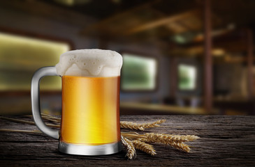 Glass of Light Beer with wheat on the wooden table in the restaurant, with copy space for your text