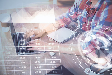 Multi exposure of forex graph with man working on computer on background. Concept of market analysis.