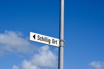 Schillig city, sign with blue sky and clouds