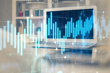 Financial chart drawing and table with computer on background. Double exposure. Concept of international markets.