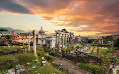 Fototapeta na wymiar Image of Roman Forum in Rome, Italy during sunset in sunny day. View of Roman Forum with the Temple of Saturn and Vespasian, Rome, Italy. Roman Forum is one of the main travel destinations in Europe.
