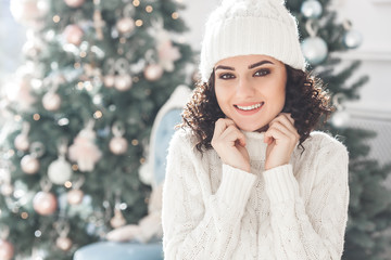 Young attractive woman at christmas background