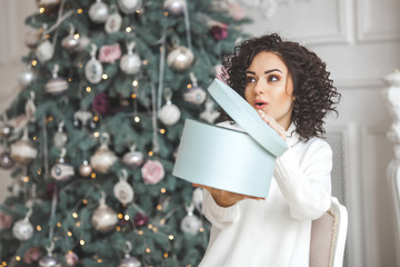 Young attractive woman at christmas background
