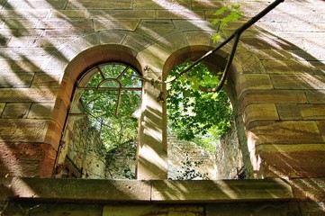 Ruins, old ruined abandoned sandstone house with vegetation. destroyed old run-down deserted empty...