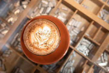 glass of hot mocha coffee on glass floor.