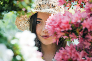 Beautiful woman working in a greenhouse