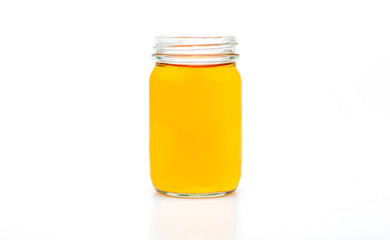 Tea in glass bottles isolated on a white background