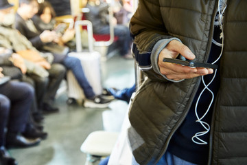 Man with cell phone in subway