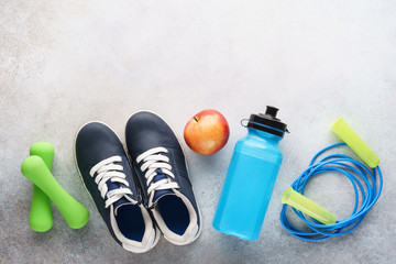 Fitness background with various sport equipment. Copy space.