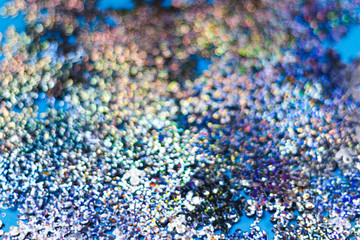 Snowflakes blur bokeh on a blue background. copy space