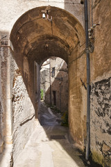 Fototapeta na wymiar A narrow street between old buildings in the medieval town of Alvito, in the Lazio region of Italy