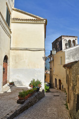 A narrow street between old buildings in the medieval town of Alvito, in the Lazio region of Italy