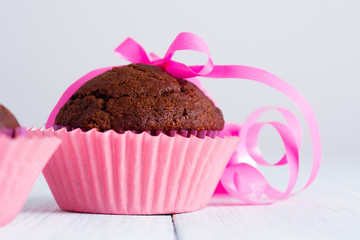 chocolate muffin on white wooden table