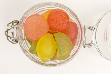 gummy candy of lemon, lime, orange and grapefruit in a glass jar