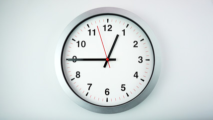 Gray wall clock face beginning of time 12.45 am or pm on White background, Copy space for your text, Time concept..