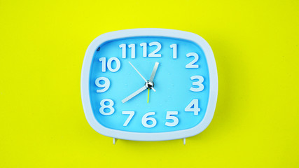 Close up Blue Alarm clock face beginning of time 12.40 on white background, Copy space for your text, Time concept..