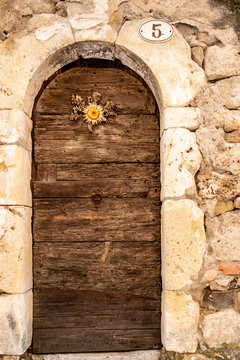lucky cardabelle nailed on an old wooden door