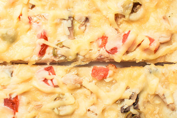 Cheese pizza with mushrooms, olives and tomatoes.