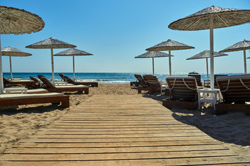 Wooden jetty on a sandy beach of Zakynthos island in Greece.